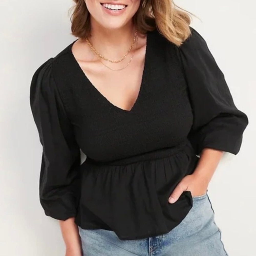 Smocked Peplum V-Neck Top. Elastic sleeves.